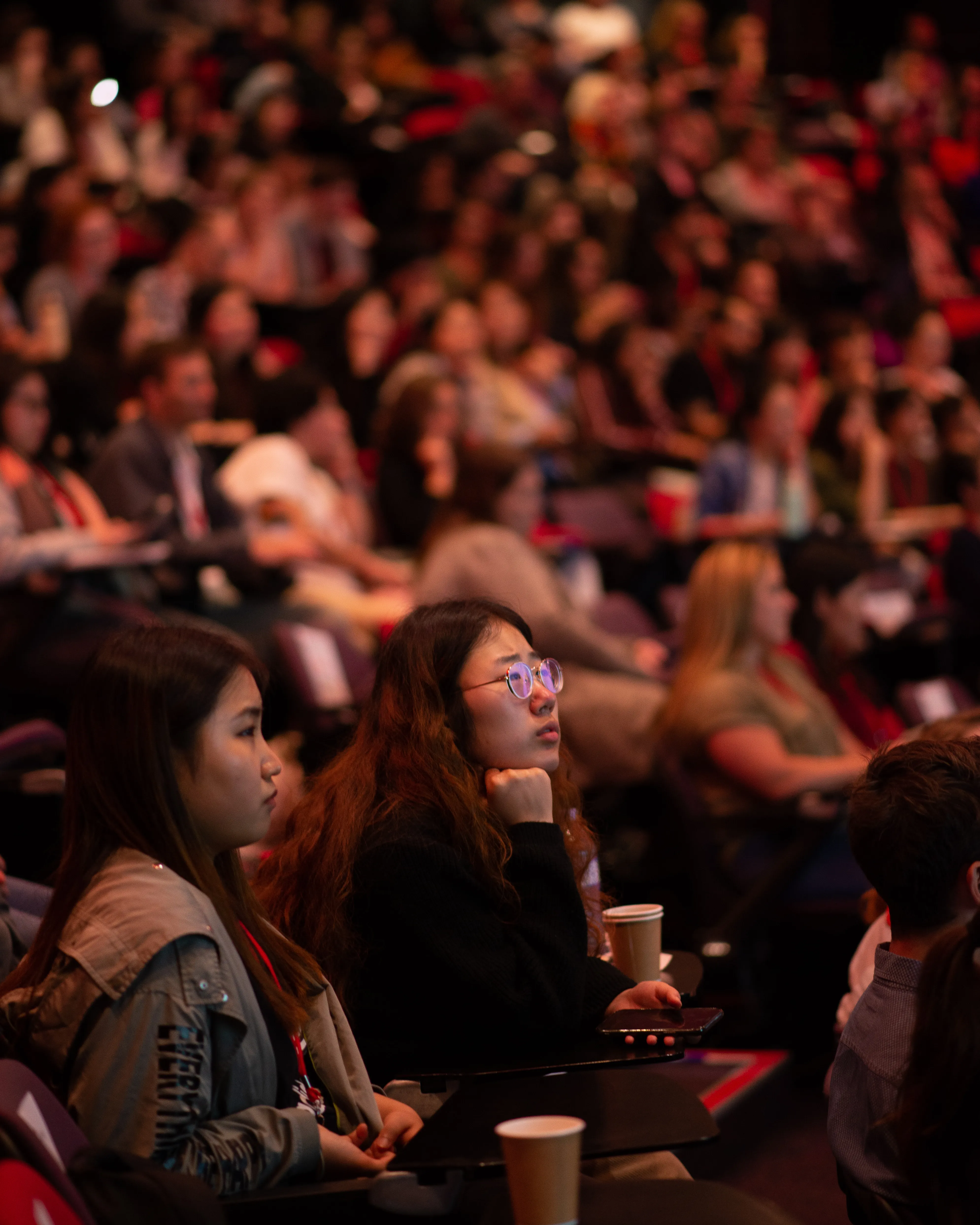 Bride and groom kissing at arched window overlooking Sydney CBD